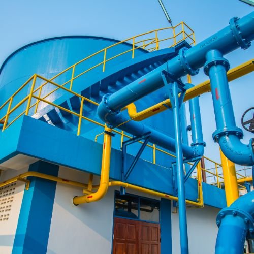 Wastewater treatment system featuring mechanical and chemical processing tanks