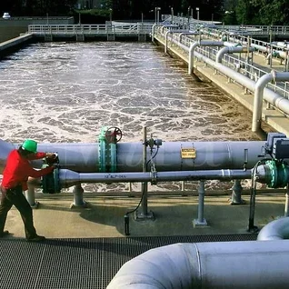 Effluent treatment plant featuring tanks, pumps, and filtration systems